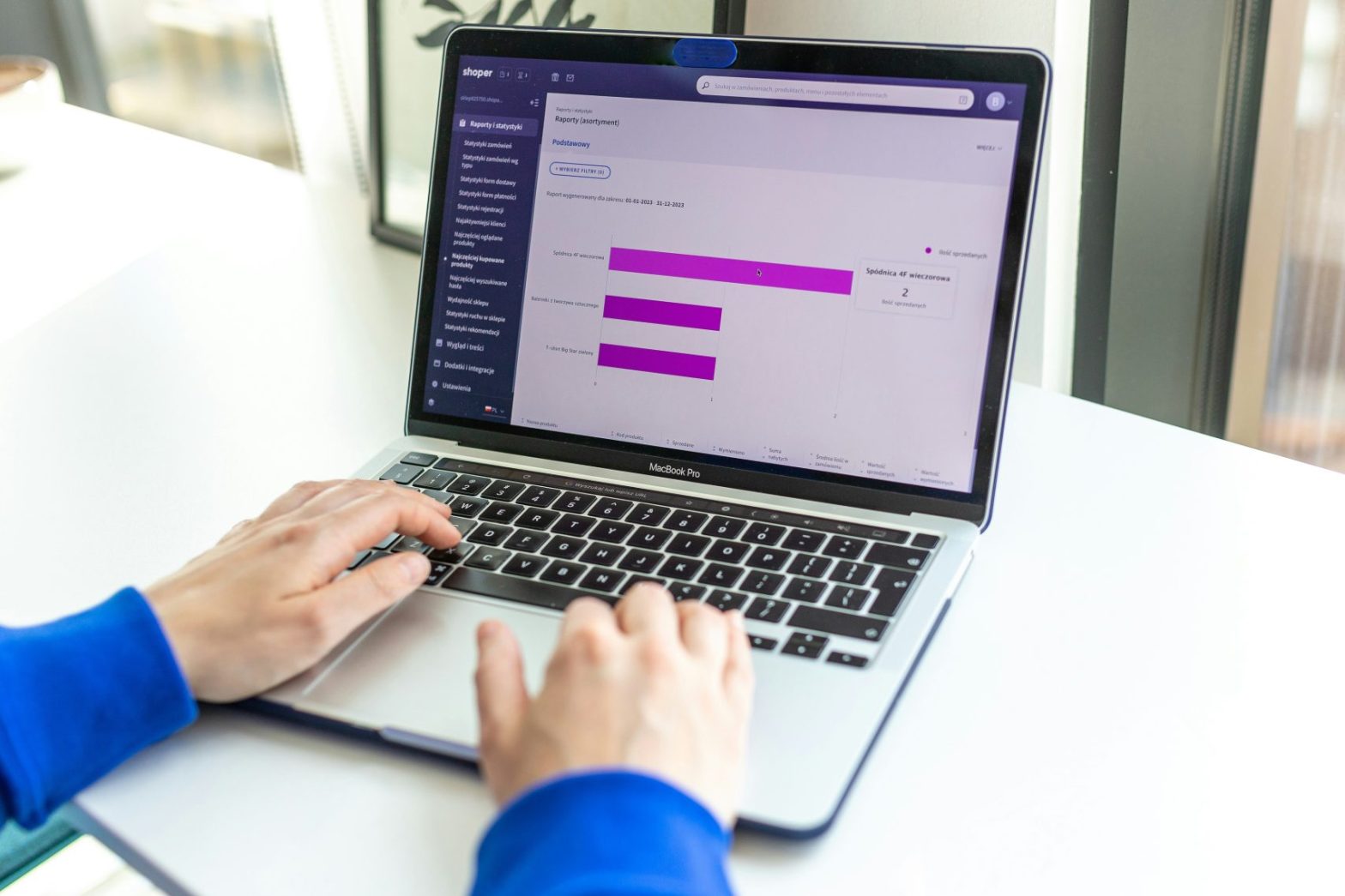 Hands typing on keyboard. Online store management board.